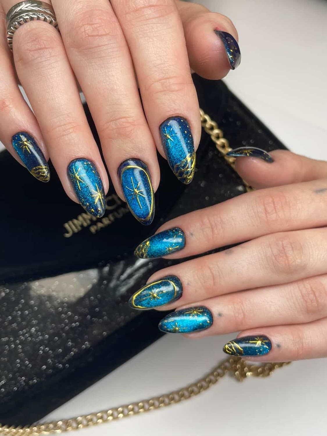 Teal stiletto nails